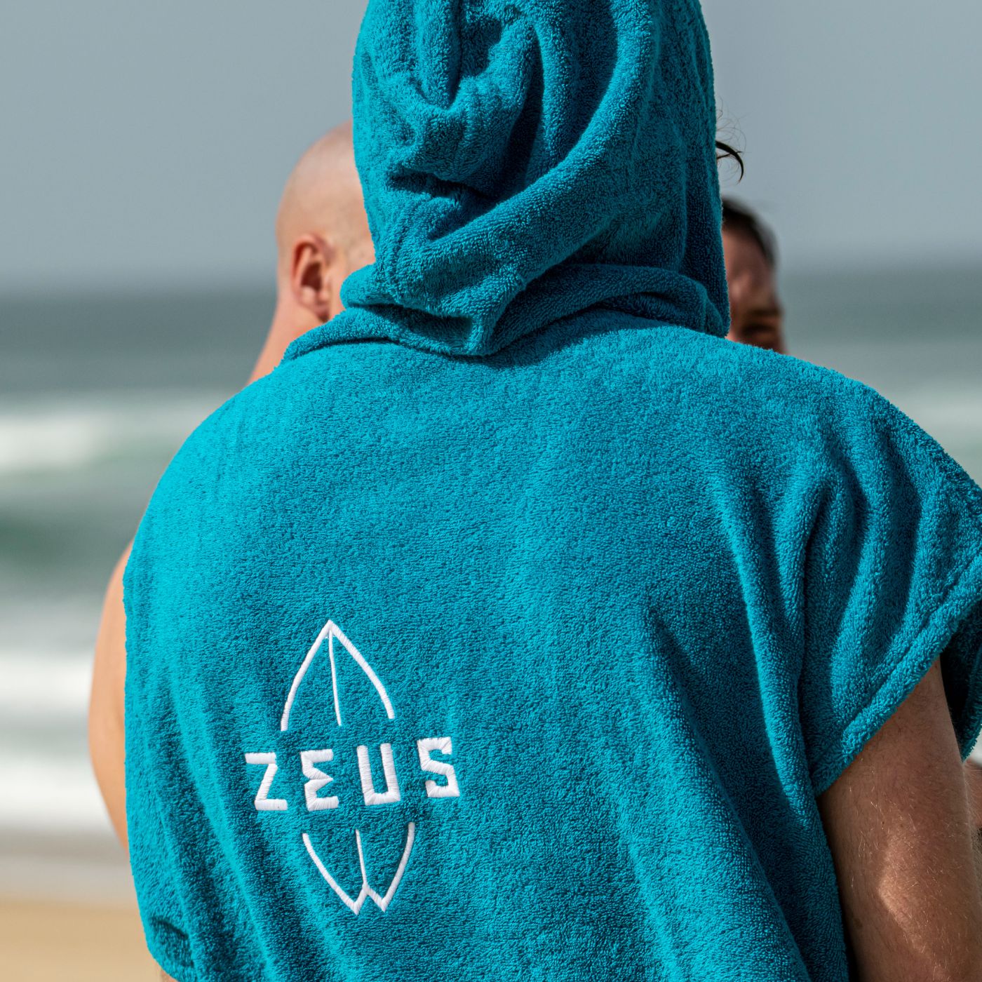 Poncho Zeus Logo Blue Poncho Zeus Surf