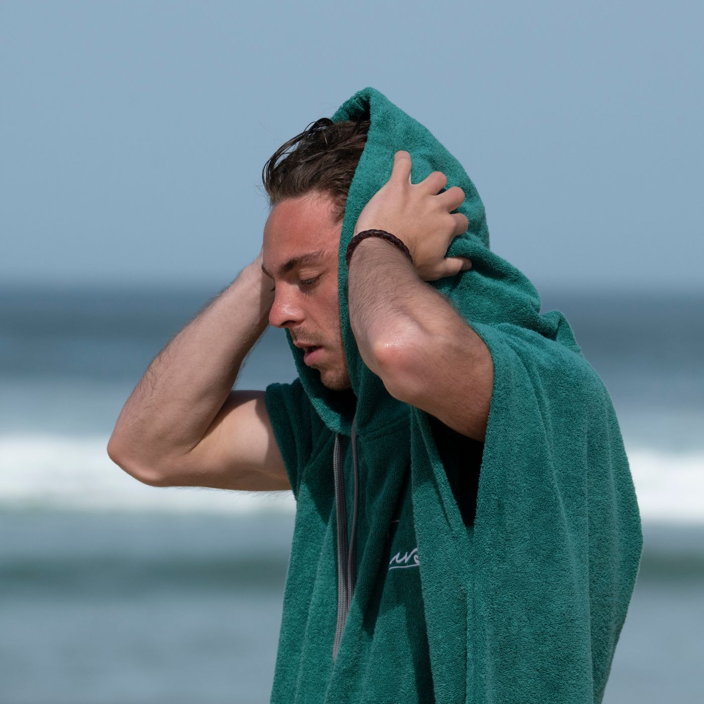 a man with a towel over his head